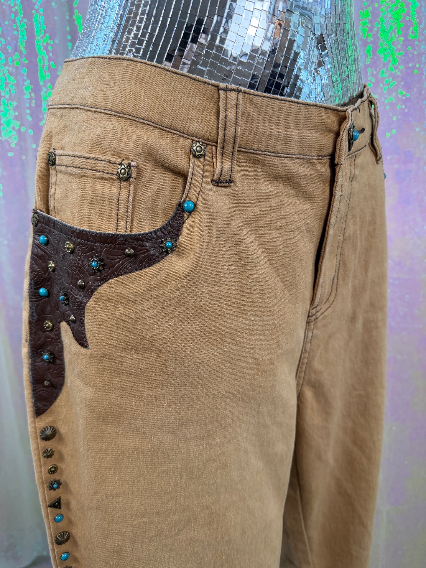 DG² by Diane Gilman (XL+) 🤠🤎🐎🪶 western Texas rancher cowboy rodeo rider embossed paisley leather with turquoise and brass studded embellishments on light brown tan straight leg pants denim jeans (factory tagged: 12P)